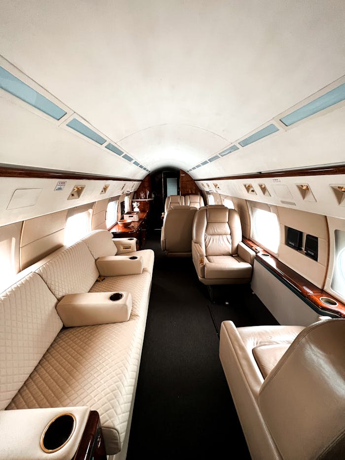 our-services-1 Experience lavish comfort with this elegant private jet interior featuring plush seating and fine craftsmanship.